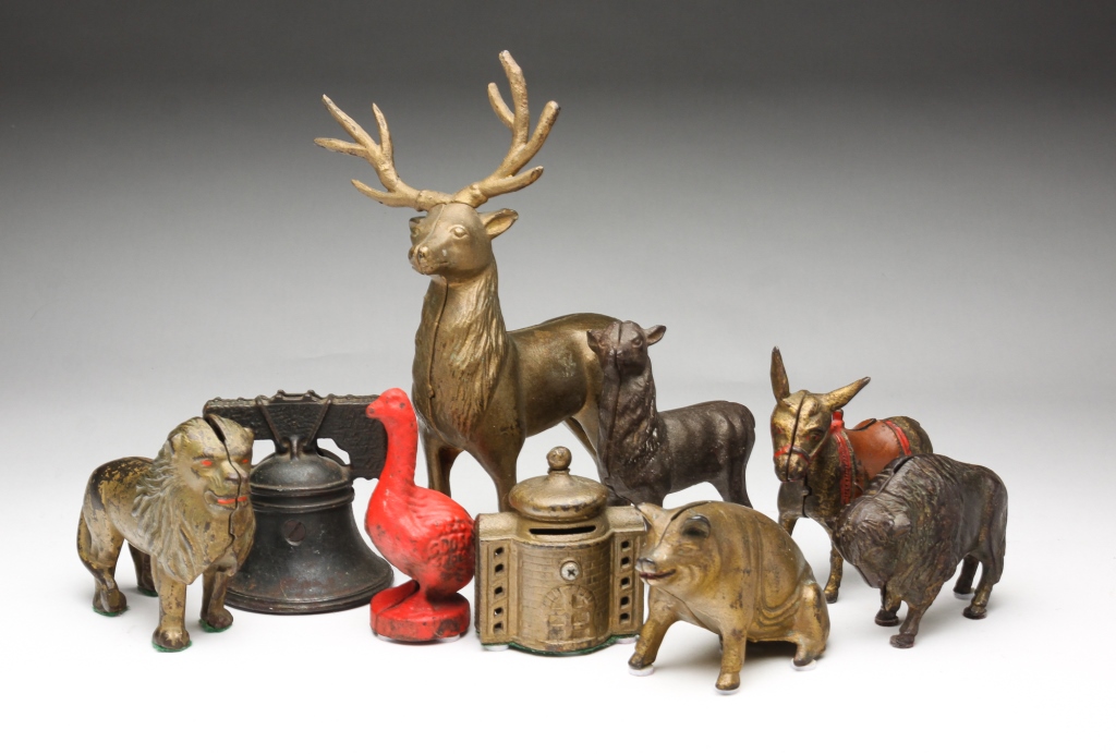 NINE AMERICAN CAST IRON BANKS.