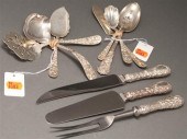 Nine American repousse silver