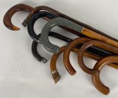 NINE ASSORTED WOODEN CANES 19T