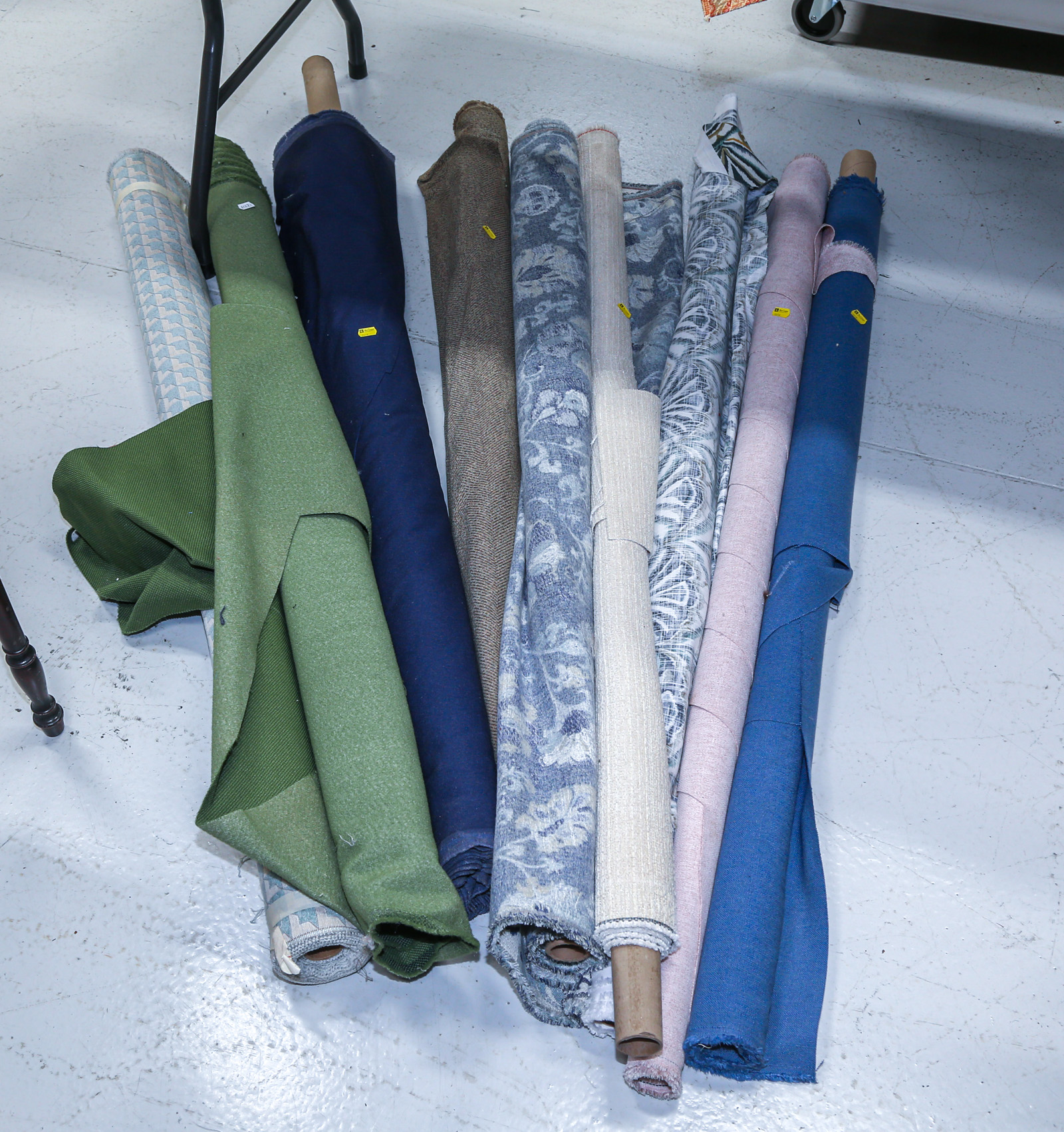 NINE BOLTS OF UPHOLSTERY FABRIC .
