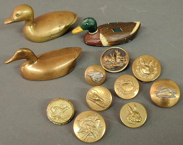 Nine brass buttons from