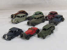 Nine Dinky toy cars.