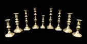 NINE EARLY BRASS CANDLESTICKS