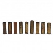 NINE EARLY BRASS SHOTGUN SHELL