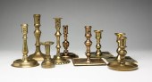 NINE EUROPEAN BRASS CANDLESTIC