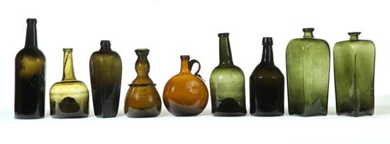 NINE GLASS SPIRITS BOTTLES. 