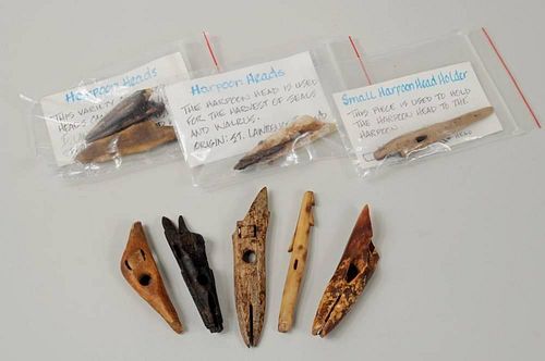 NINE INUIT CARVED FOSSILIZED