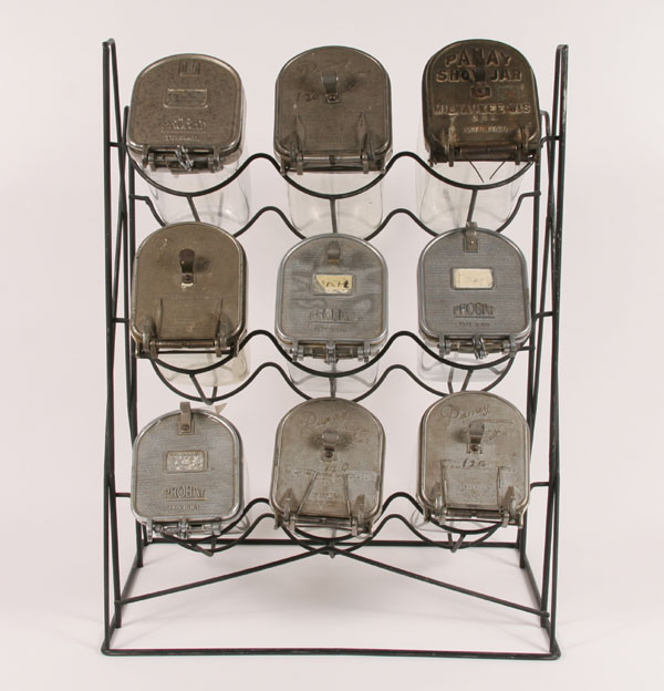 Nine large glass seed jars on