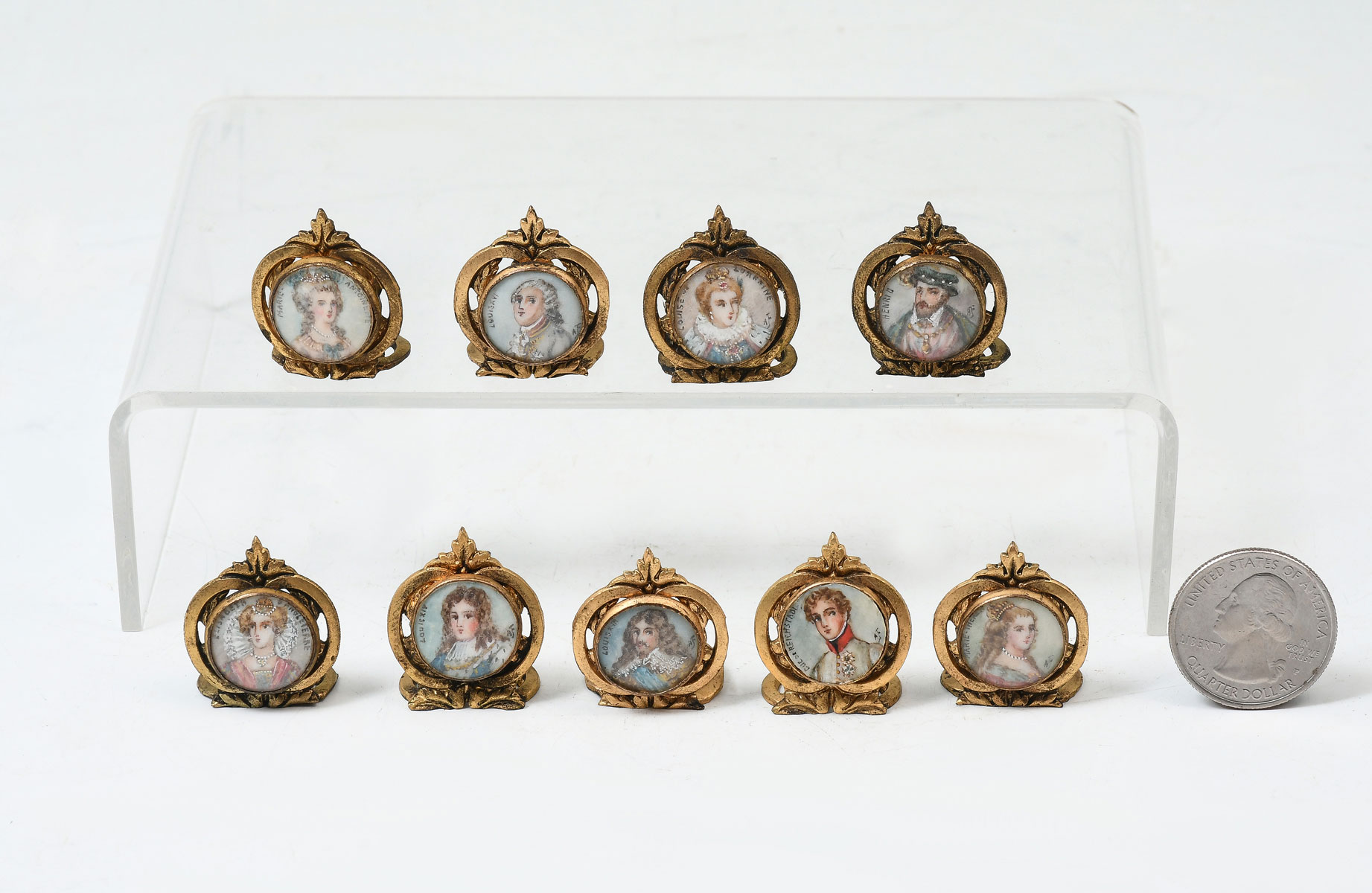NINE PIECE GILT METAL FRAMED