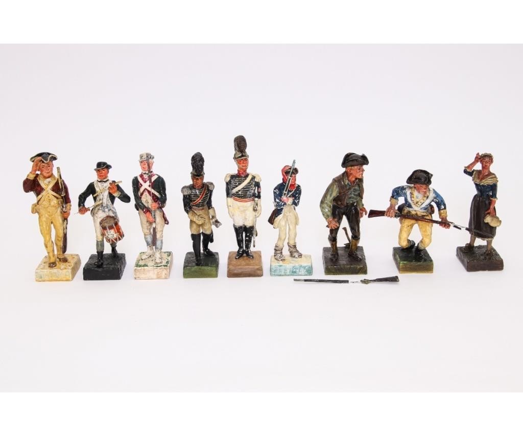 Nine plaster soldiers including the