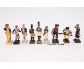 Nine plaster soldiers includin
