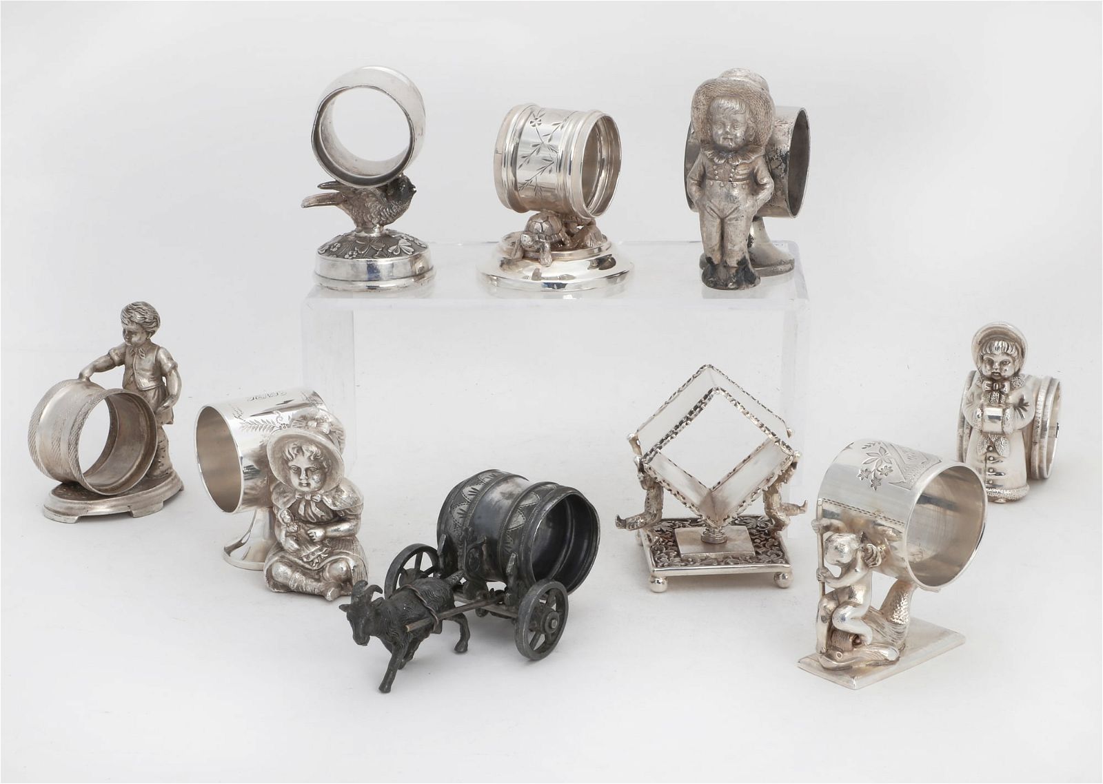 NINE SILVER PLATE FIGURAL NAPKIN