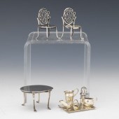 NINE STERLING SILVER DOLL HOUS