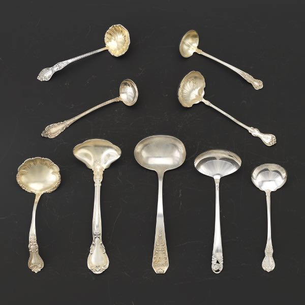NINE STERLING SILVER LADLES,