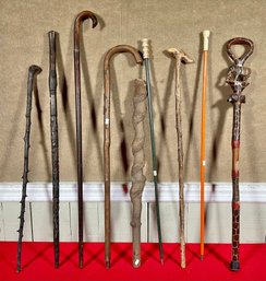 Nine vintage carved wooden canes.