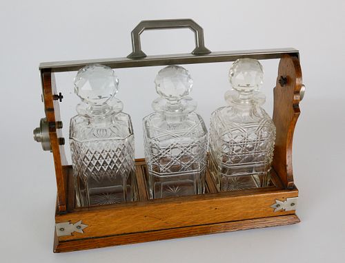 OAK AND CRYSTAL TANTALUS SET,