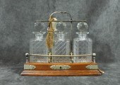 OAK AND CUT GLASS TANTALUS SET