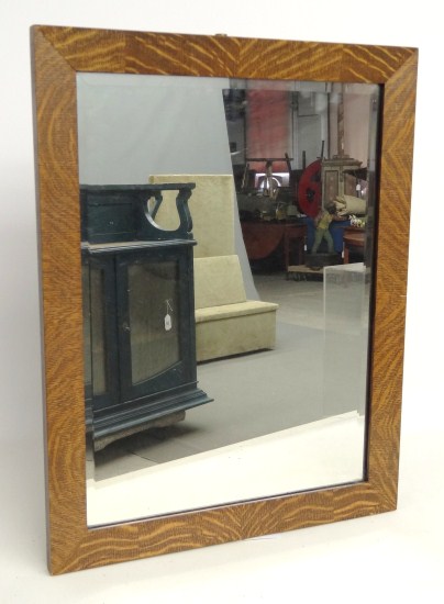 Oak beveled mirror. 21'' x 27''.