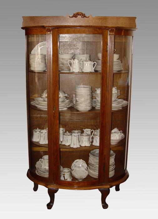 OAK CARVED BOWFRONT CHINA