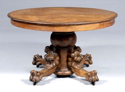 Oak lion carved pedestal table,