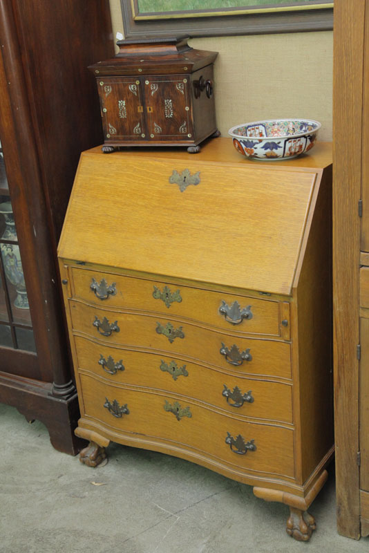 OAK SLANT LID SERPENTINE DESK. With