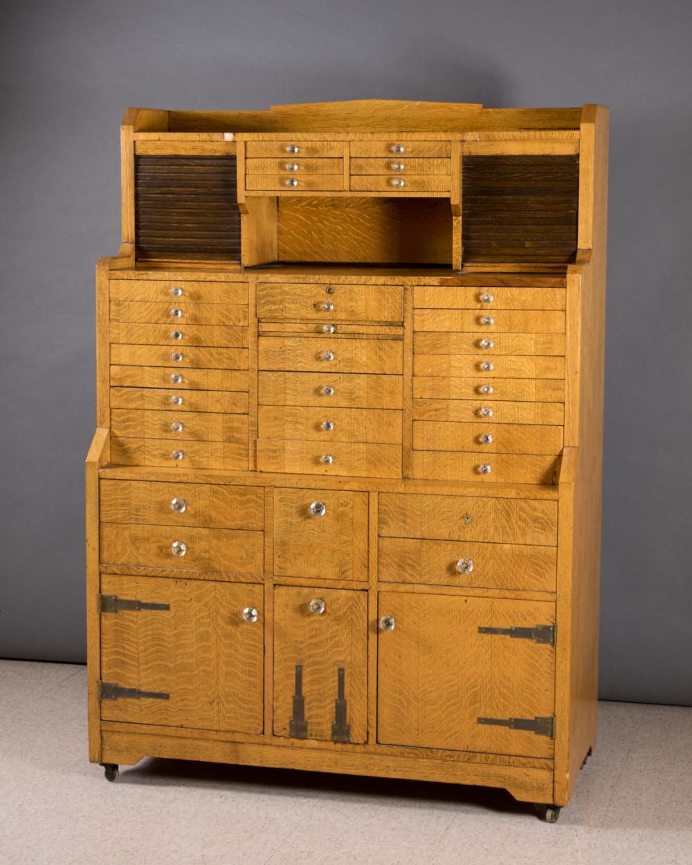 OAK STEP-FRONT DENTAL CABINET,