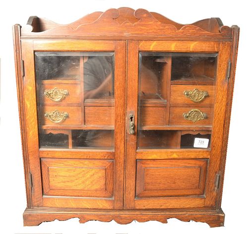OAK TWO DOOR CABINET, HAVING