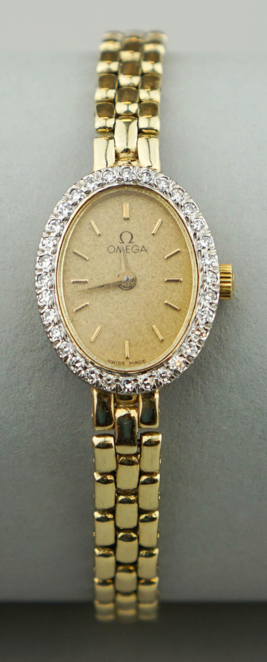 OMEGA LADIES 14K YELLOW GOLD AND