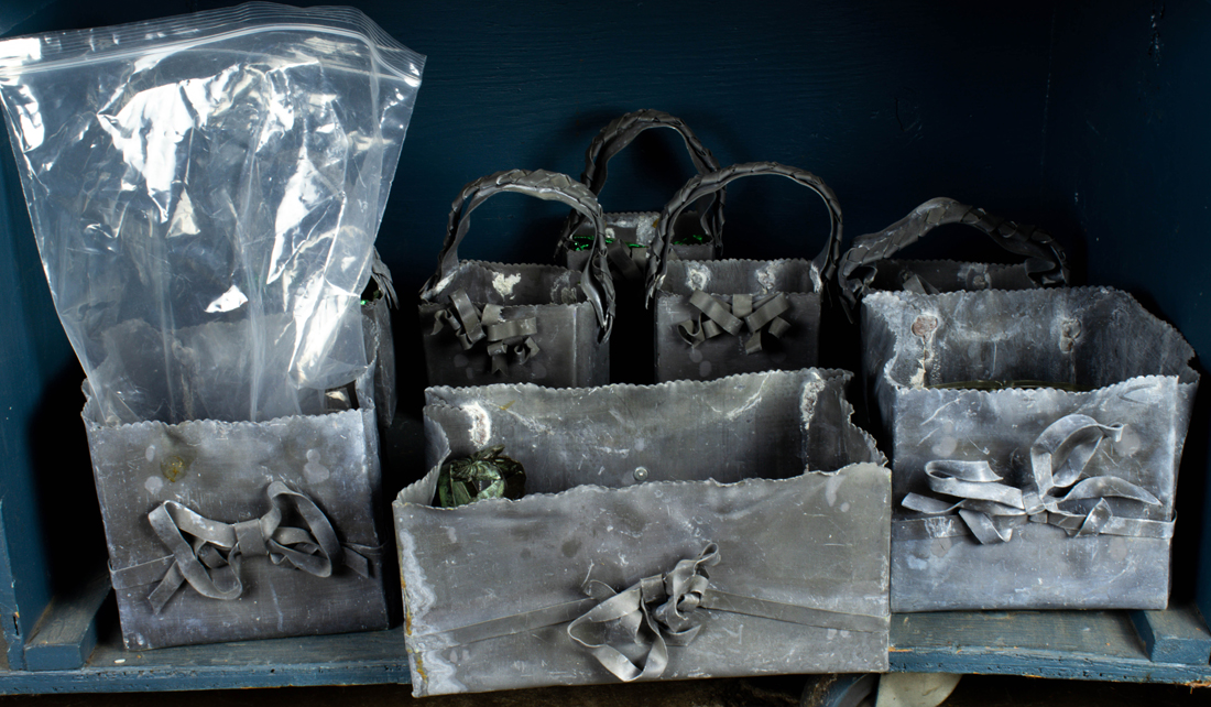 ONE BIN OF LEAD PLANTERS, EACH IN