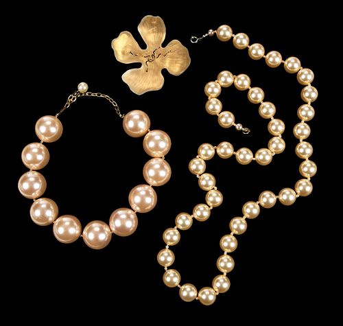 ONE DESIGNER FLOWER BROOCH, AND TWO