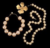 ONE DESIGNER FLOWER BROOCH, AN
