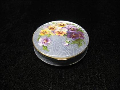 One gold compact with mirror and