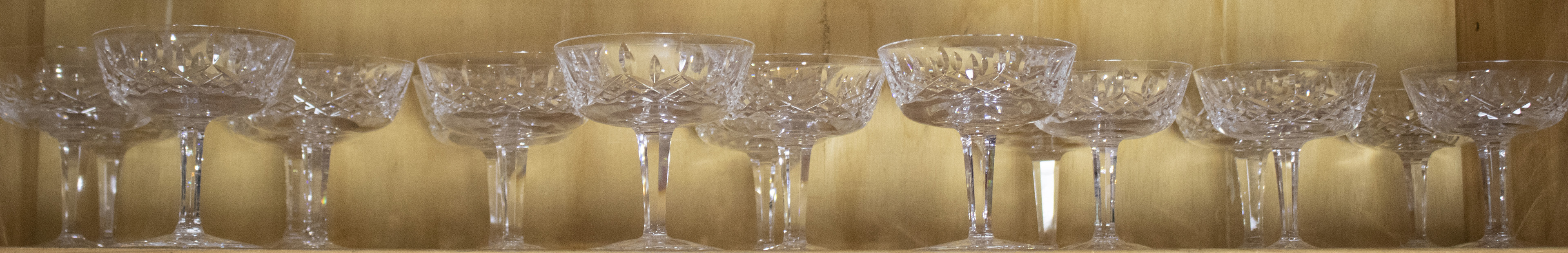 ONE SHELF OF CUT GLASS COUPES One