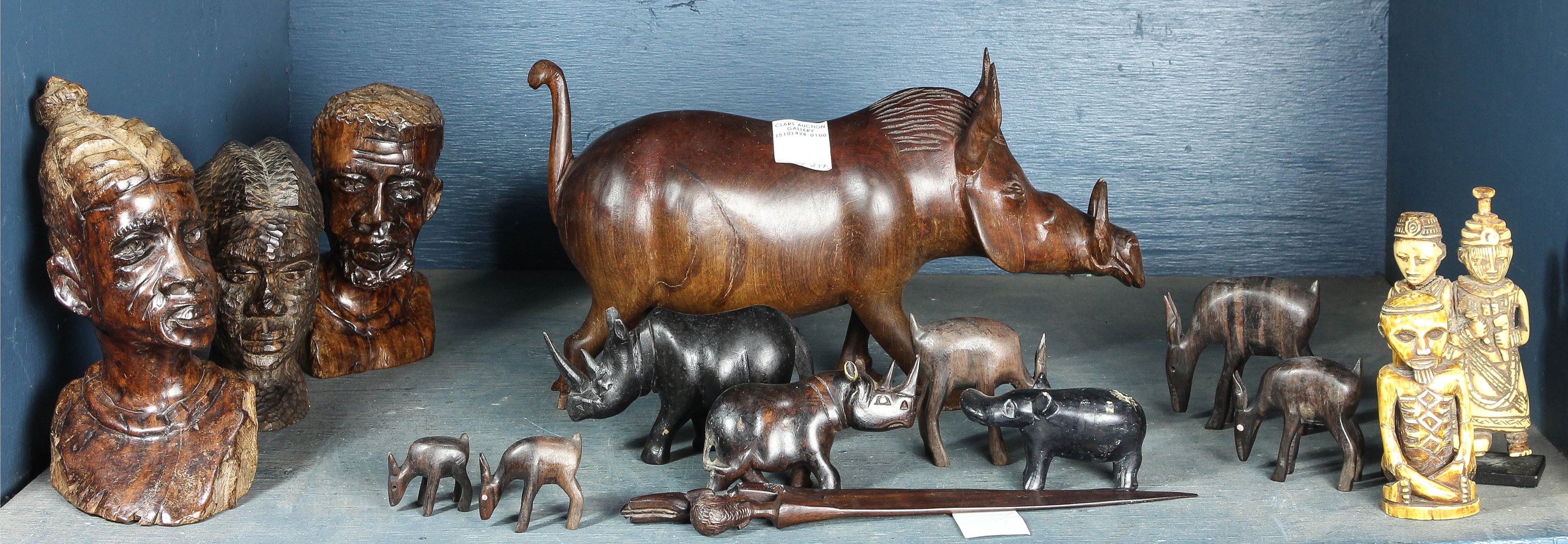ONE SHELF OF MOSTLY AFRICAN STYLE