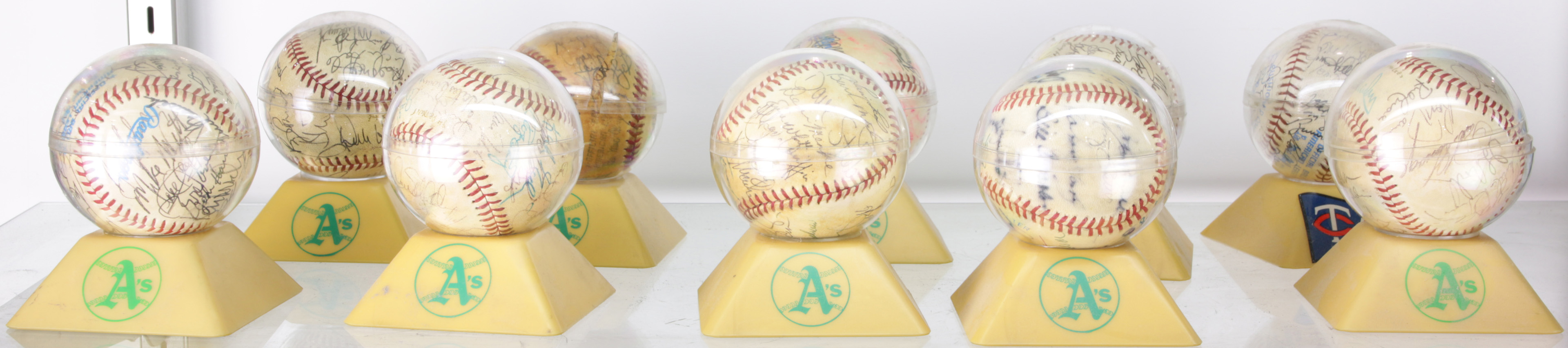 ONE SHELF OF SIGNED BASEBALLS One