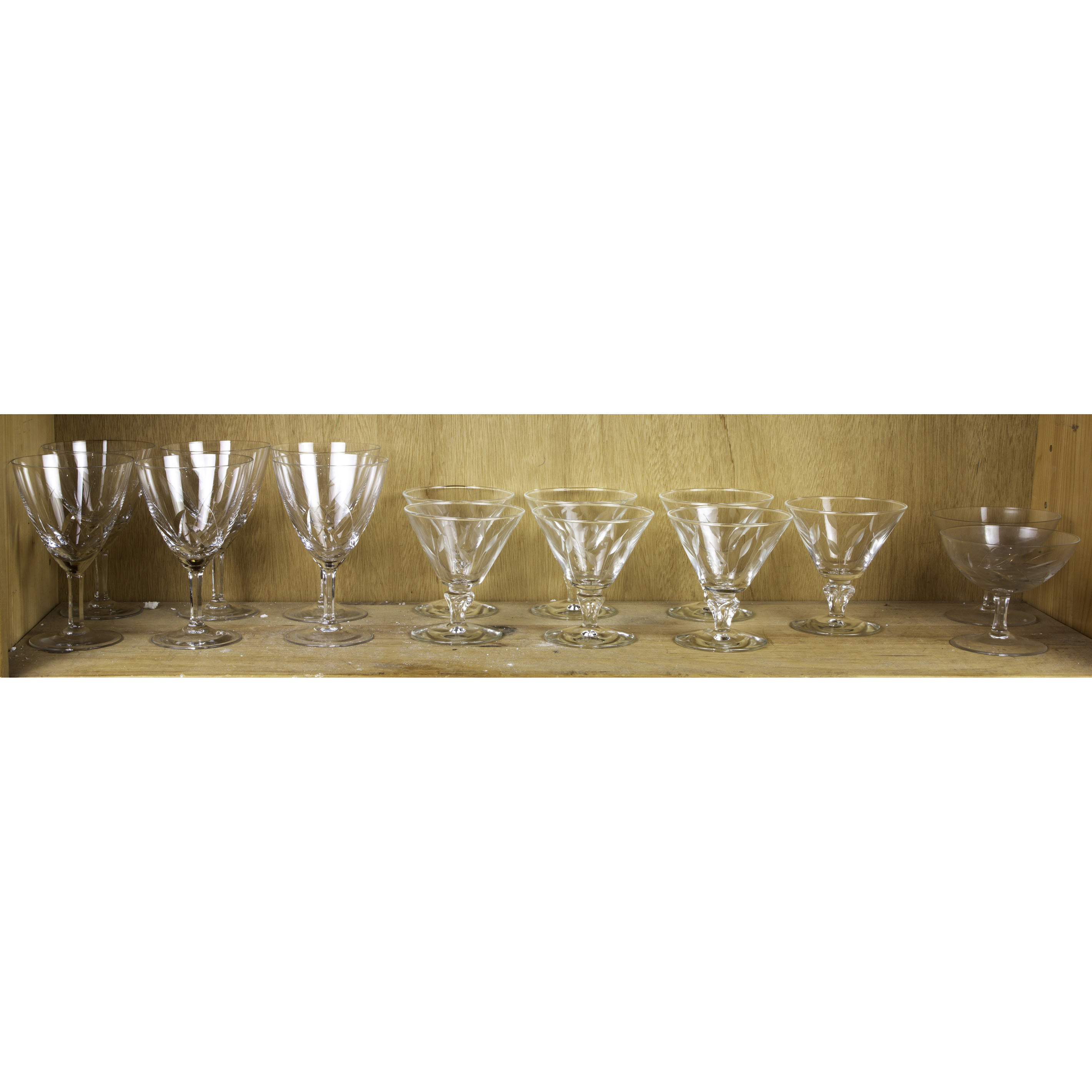 ONE SHELF OF STEMWARE ENGRAVED WITH