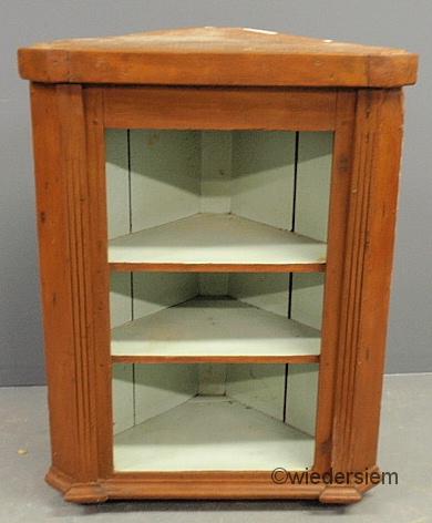 Open hanging corner cupboard with