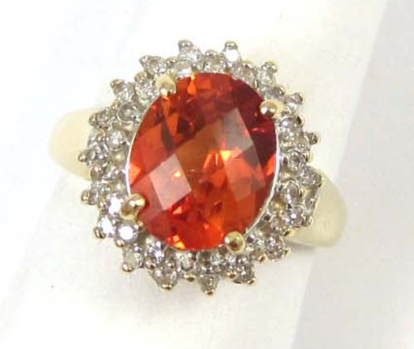 ORANGE SAPPHIRE AND DIAMOND RING