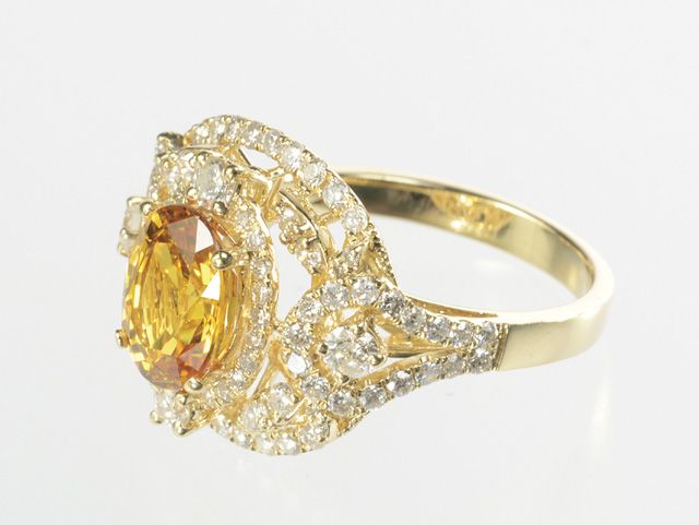 ORANGE SAPPHIRE AND DIAMOND RING