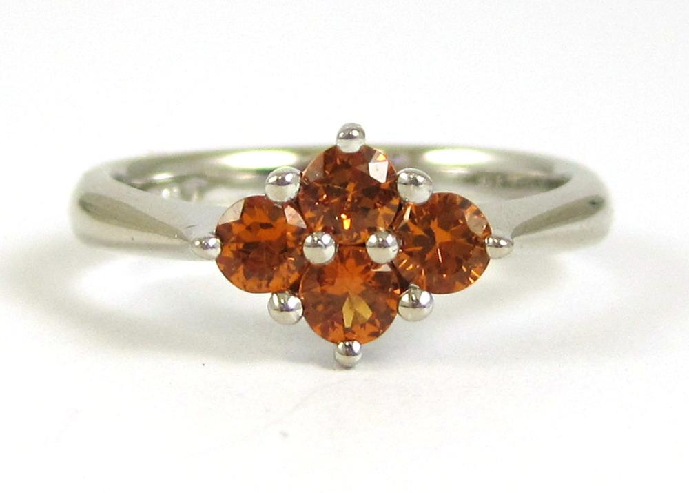 ORANGE SAPPHIRE AND TEN KARAT WHITE