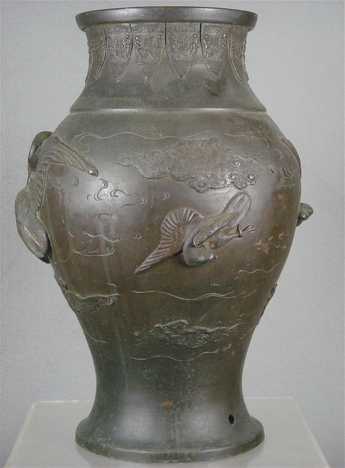 Oriental bronze vase with raised