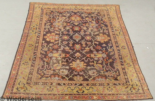Oriental carpet aubergine field and