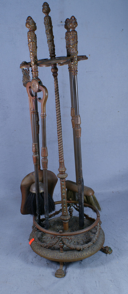 Ornate bronze fireplace tool