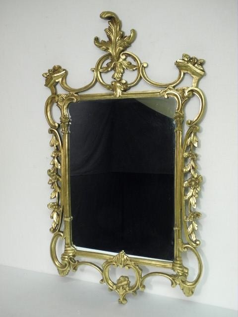 Ornately carved gold gilt mirror.
