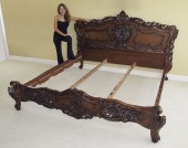 ORNATELY CARVED MAHOGANY BED: