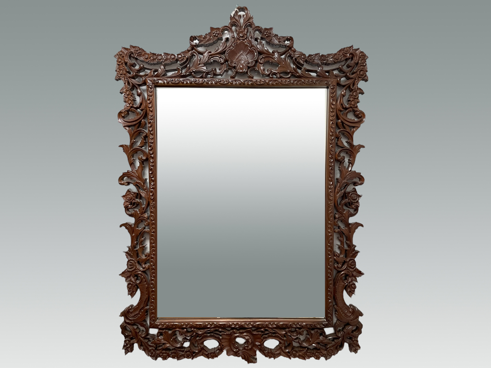 ORNATELY CARVED WALL MIRROR: Having