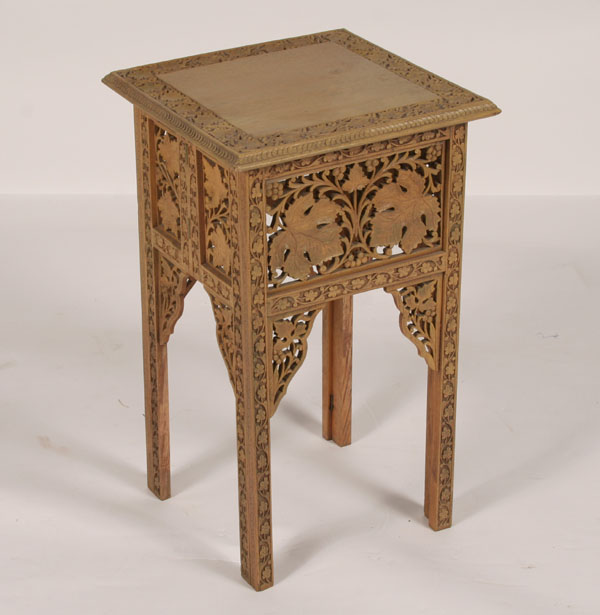 Ornately carved wooden stand/table;