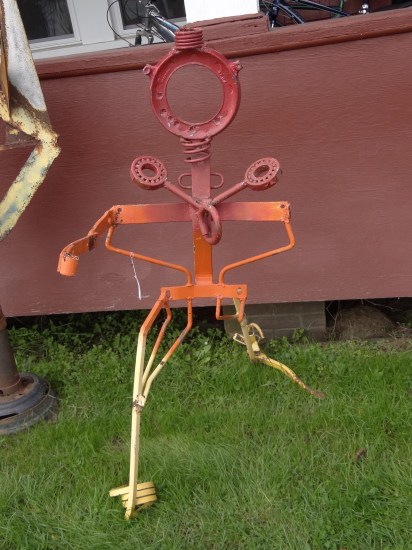 Outdoor sculpture walking figure.