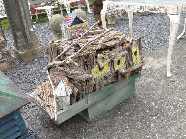 Outsider art birdhouse. 31'' W 25''