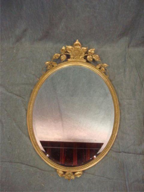 Oval and Giltwood Mirror. From a